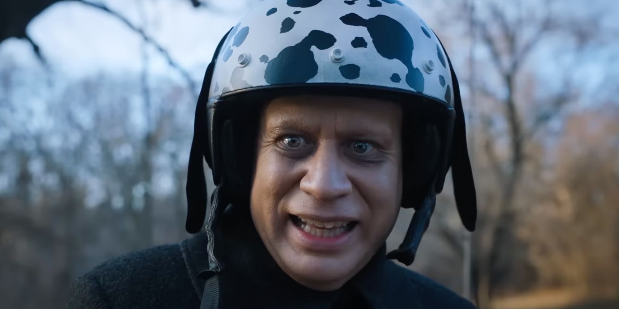 Fred Armisen as Uncle Fester Addams wearing a helmet in Wednesday season 1