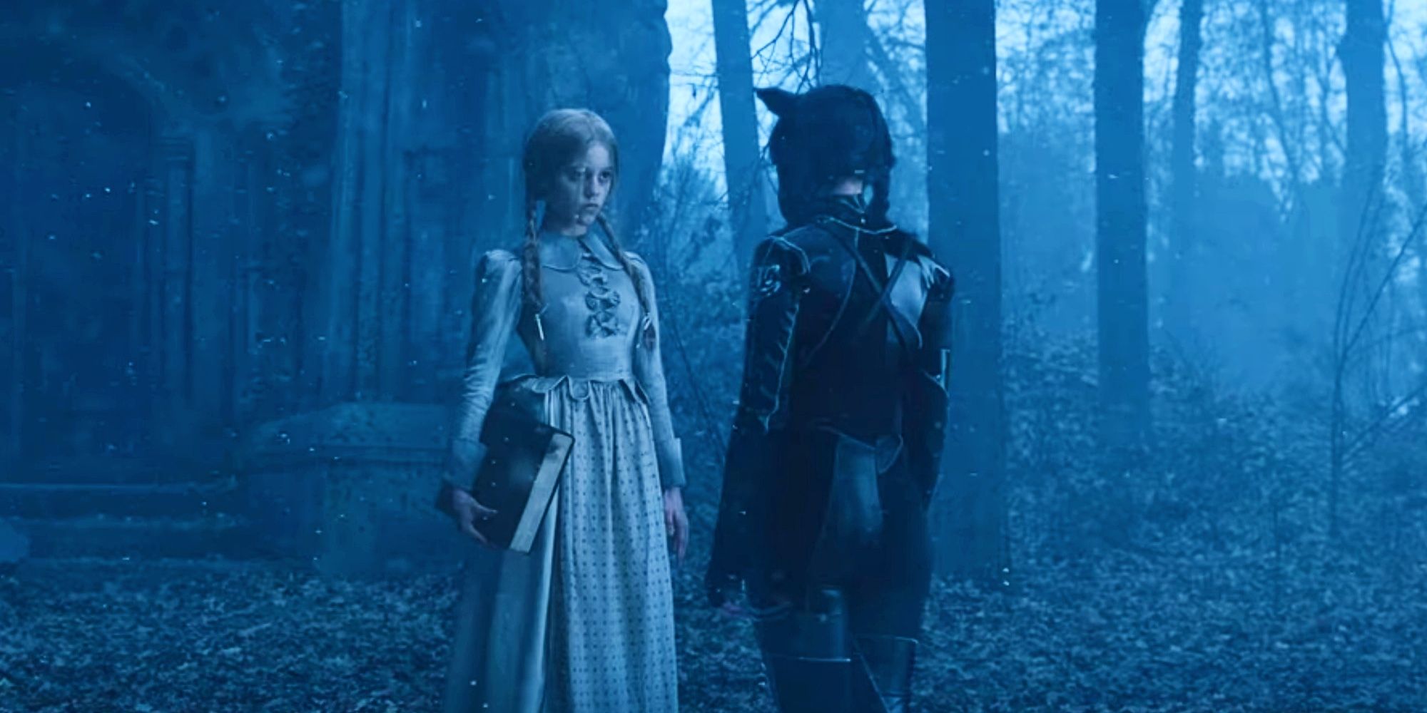 Goody and Wednesday Addams facing each other in the forest in Wednesday Season 1 