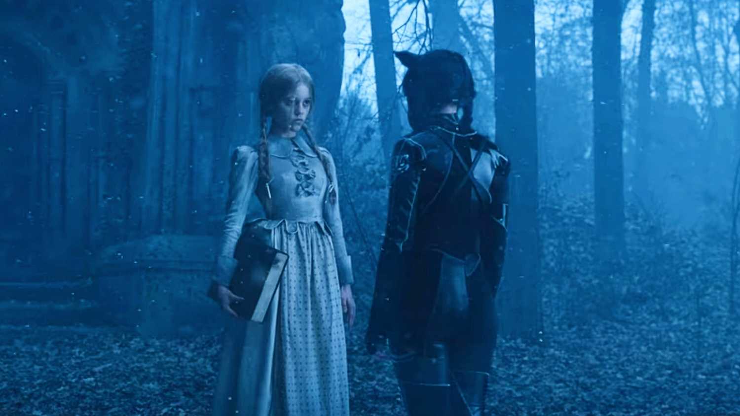 Goody and Wednesday Addams facing each other in the forest in Wednesday Season 1