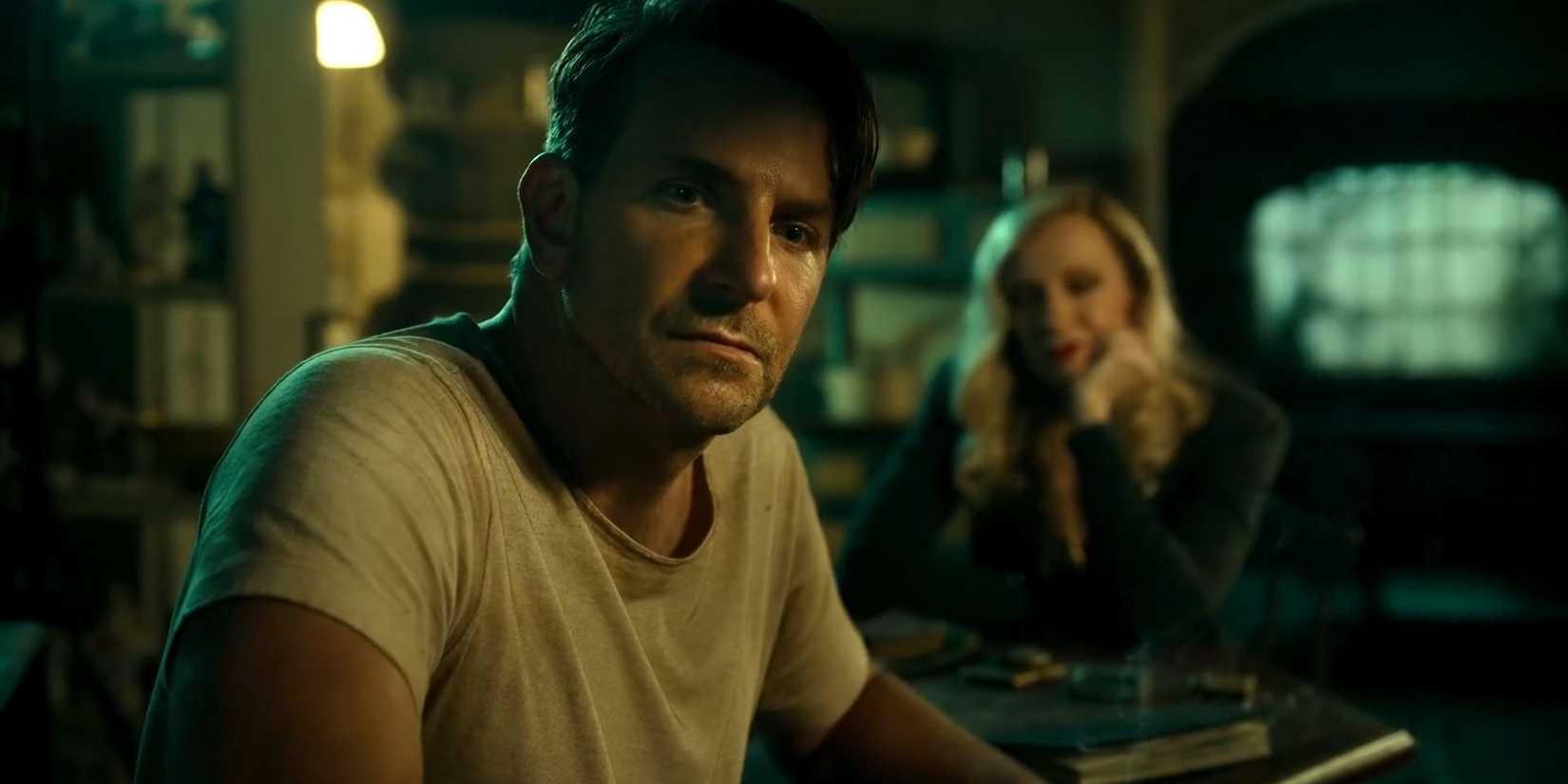 Bradley_Cooper_sitting_in_the_dark_in_Nightmare_Alley