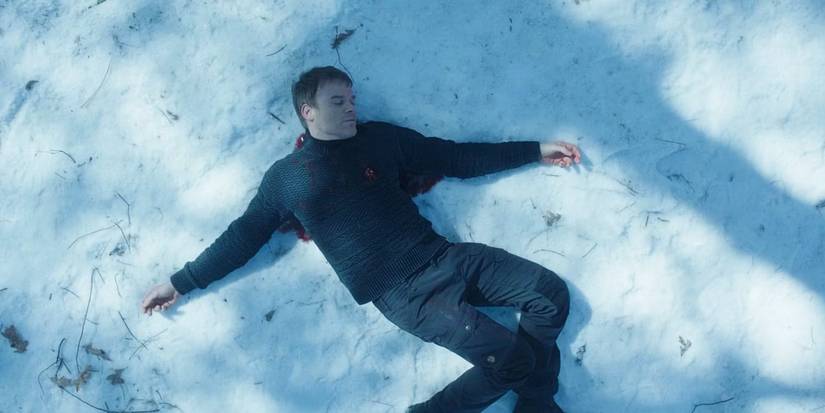 Michael C. Hall as Dexter Morgan lying on the snow in the Dexter: New Blood finale