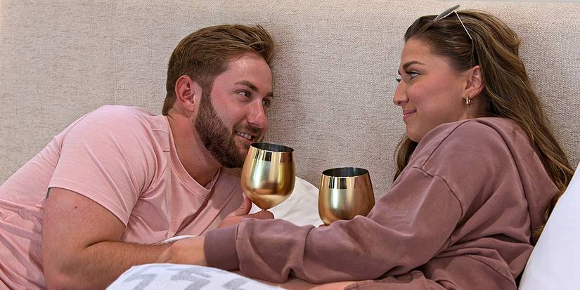 Love is blind's matt and colleen with gold goblets smiling at each other