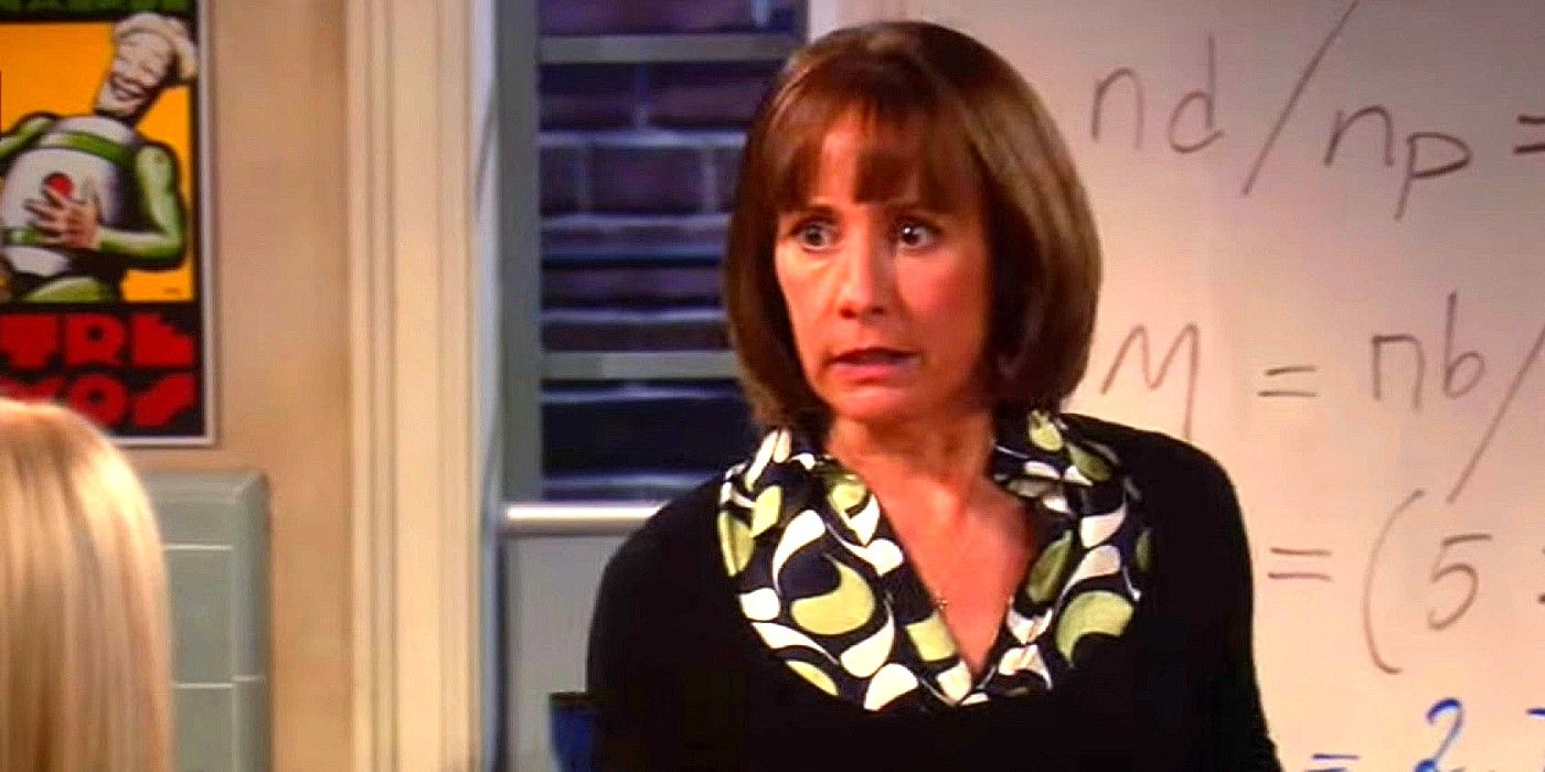 Mary Cooper staring intensely with a whiteboard of equations behind her in The Big Bang Theory