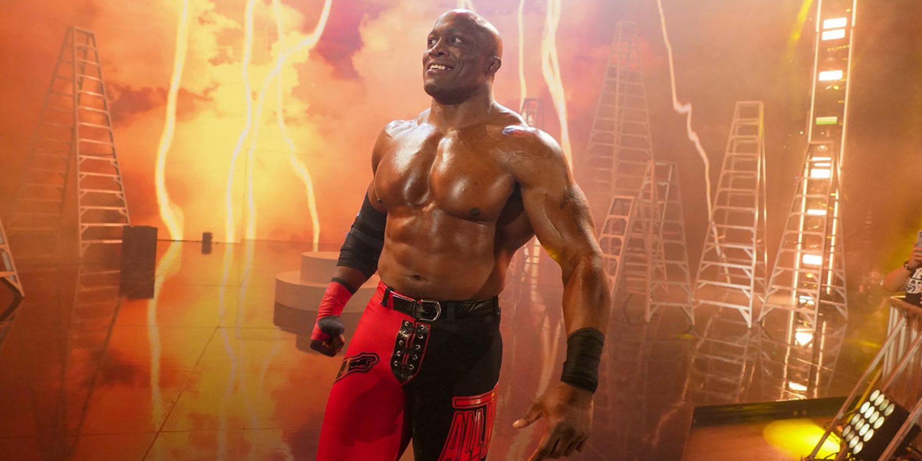 Bobby Lashley grins at the crowd as he makes his entrance during an episode of WWE Monday Night Raw in 2022.