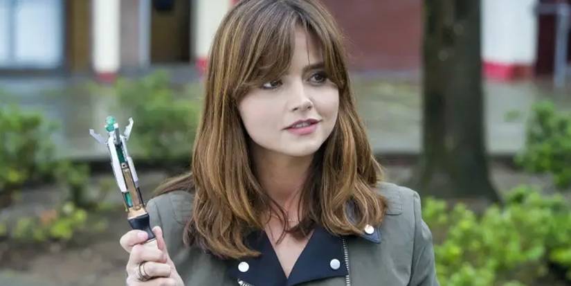 Jenna Coleman holding the Sonic Screwdriver as Clara Oswald in the Doctor Who episode "Flatline."