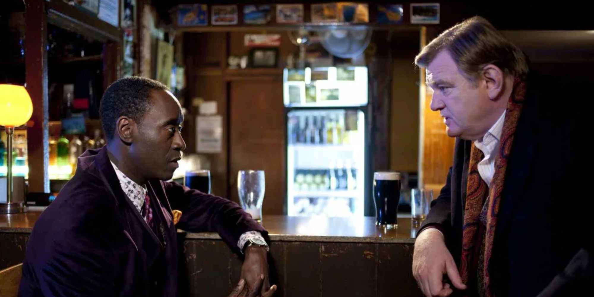 Don Cheadle and Brendan Gleeson talking at a bar in The Guard (2011)