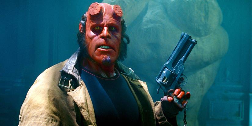 Ron Perlman as Hellboy holding his revolver in Hellboy