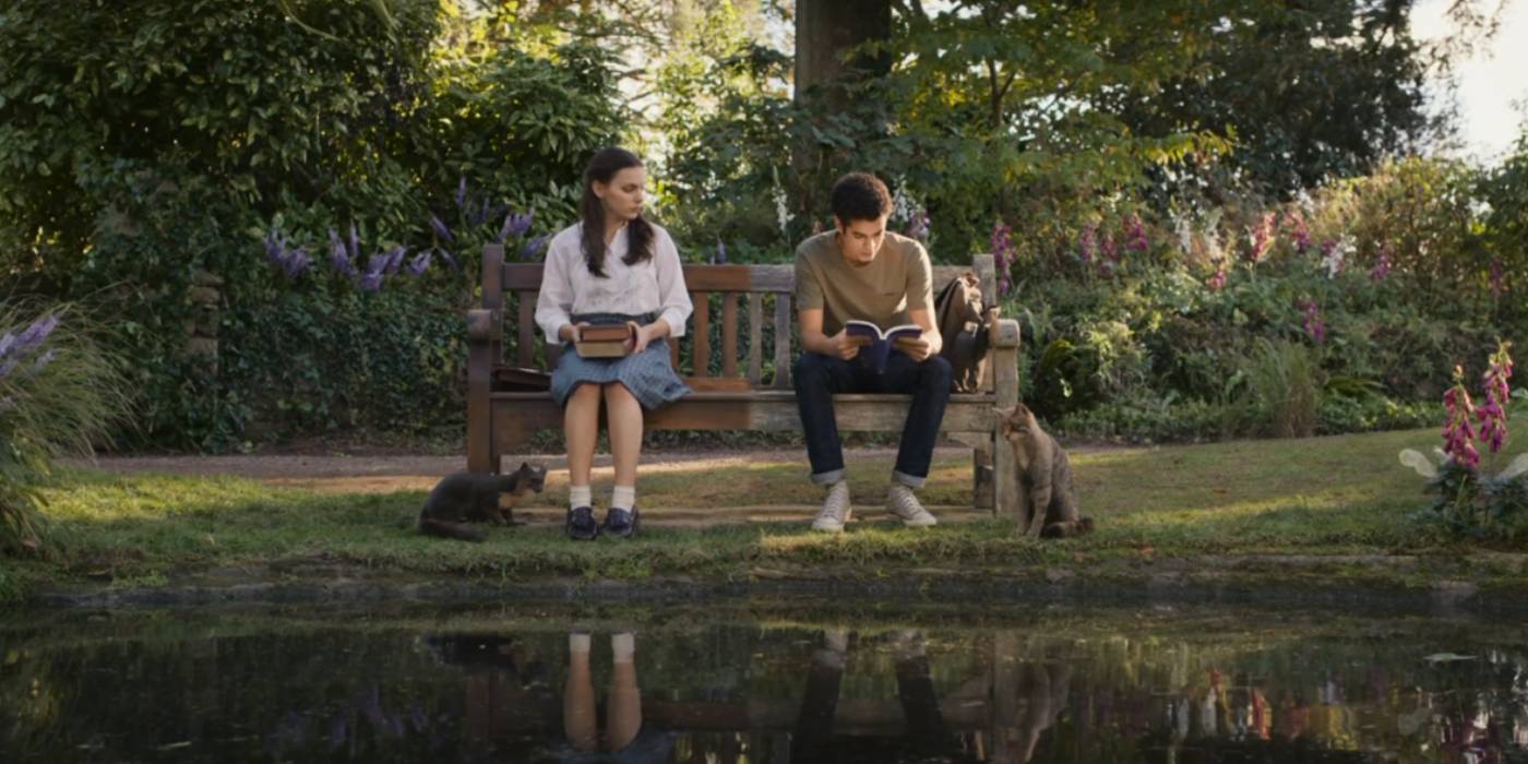 Lyra and Will sitting on a bench in His Dark Materials 