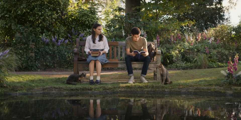 Lyra and Will sitting on a bench in His Dark Materials