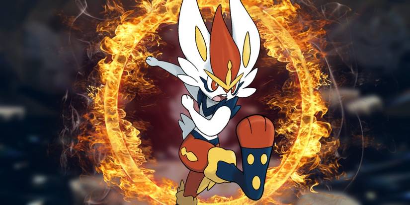 Покемон Cinderace из Pokémon Scarlet и Violet бьет воздух, а за ним формируется кольцо огня. На заднем плане - пещера для Tera Raid.