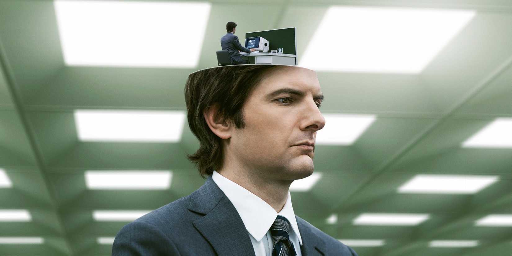Adam Scott as Mark in Severance whose head opens to show up to an office