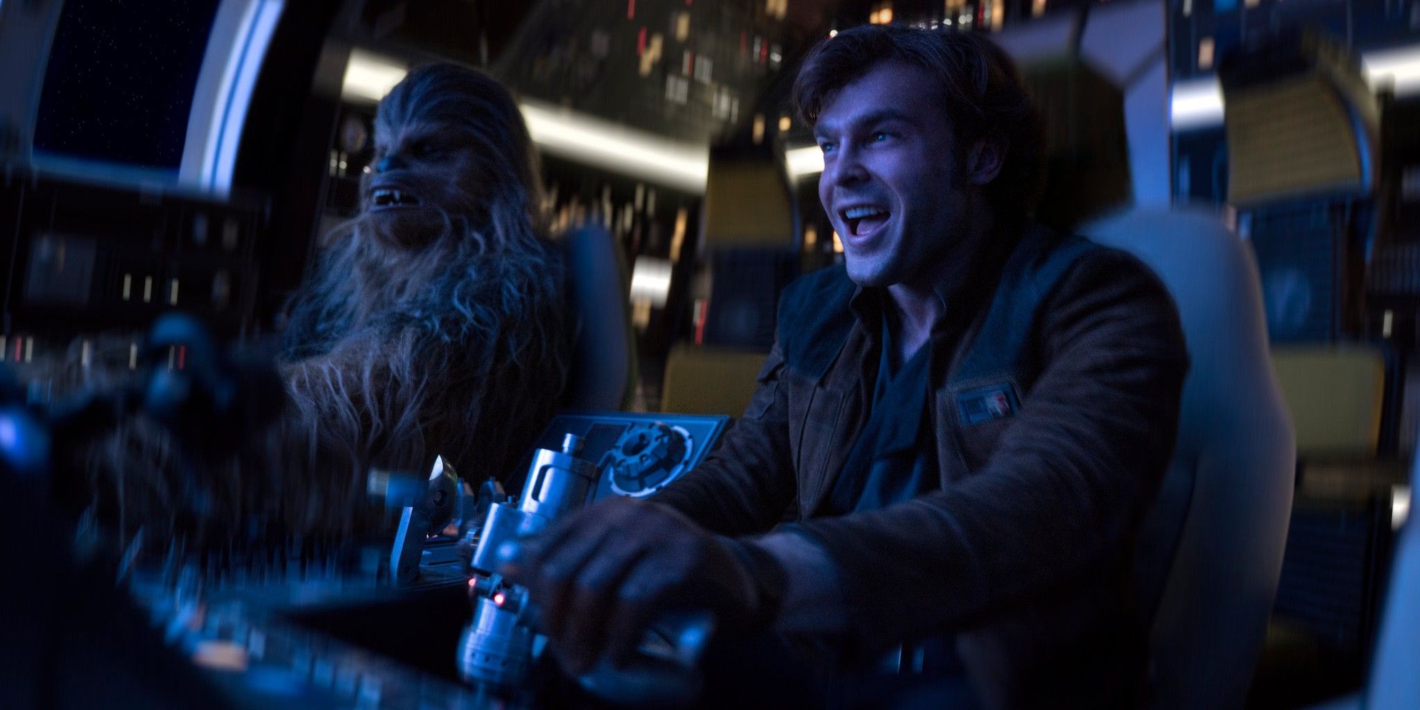 Chewbacca and Han in Solo: A Star Wars Story flying the Falcon