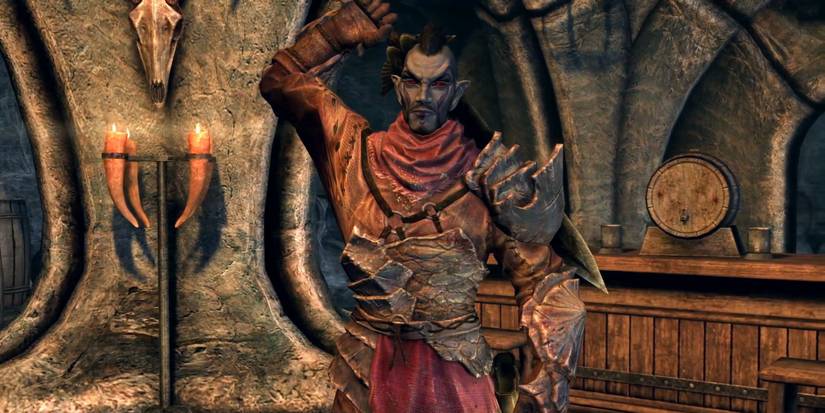 Teldryn Sero pulling out his sword in Skyrim.