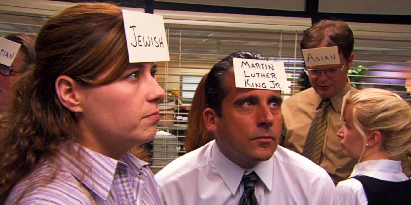 Pam (Jenna Fischer) wearing a card on her head that says 