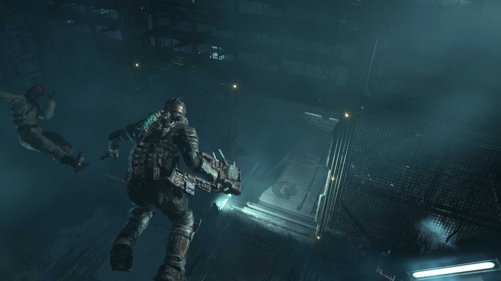 Dead Space character Isaac Clarke is seen floating in Z gravity while his weapons light illuminates a platform below him, all while a dead body hovers to his left.