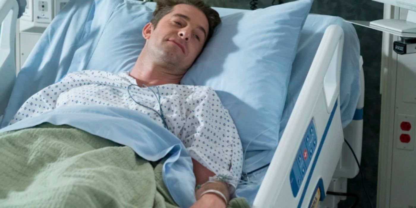 Nick lying in his hospital bed on Grey's Anatomy