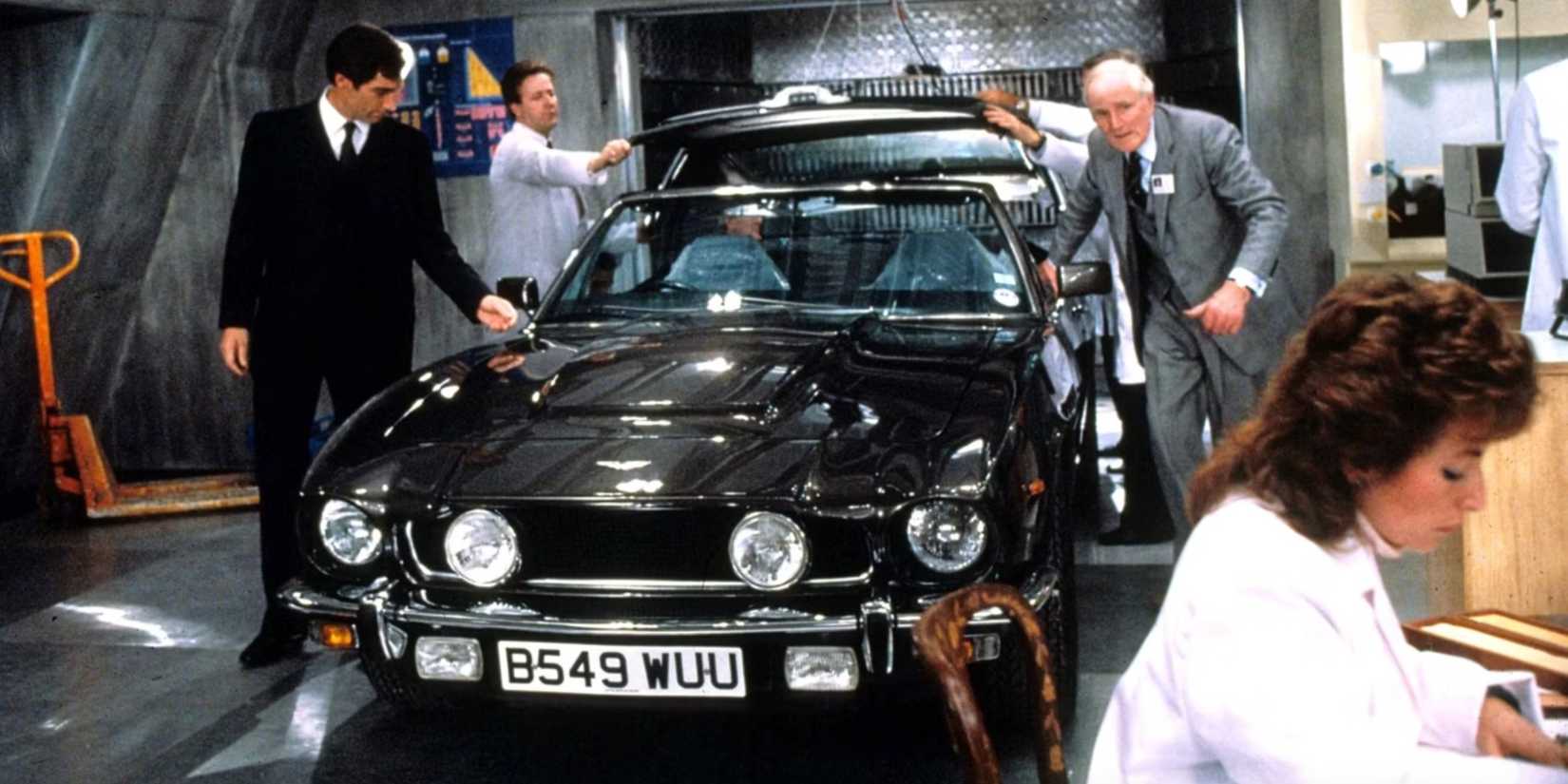 The Aston Martin V8 Vantage Volante being presented by Q (Desmond Llewelyn) to Bond (Timothy Dalton) in The Living Daylights.