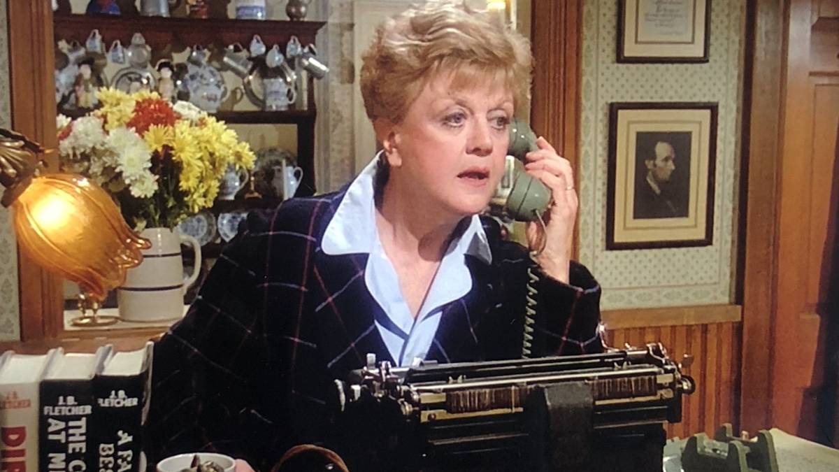 Jessica Fletcher on the phone in front of her typewriter in Murder She Wrote.