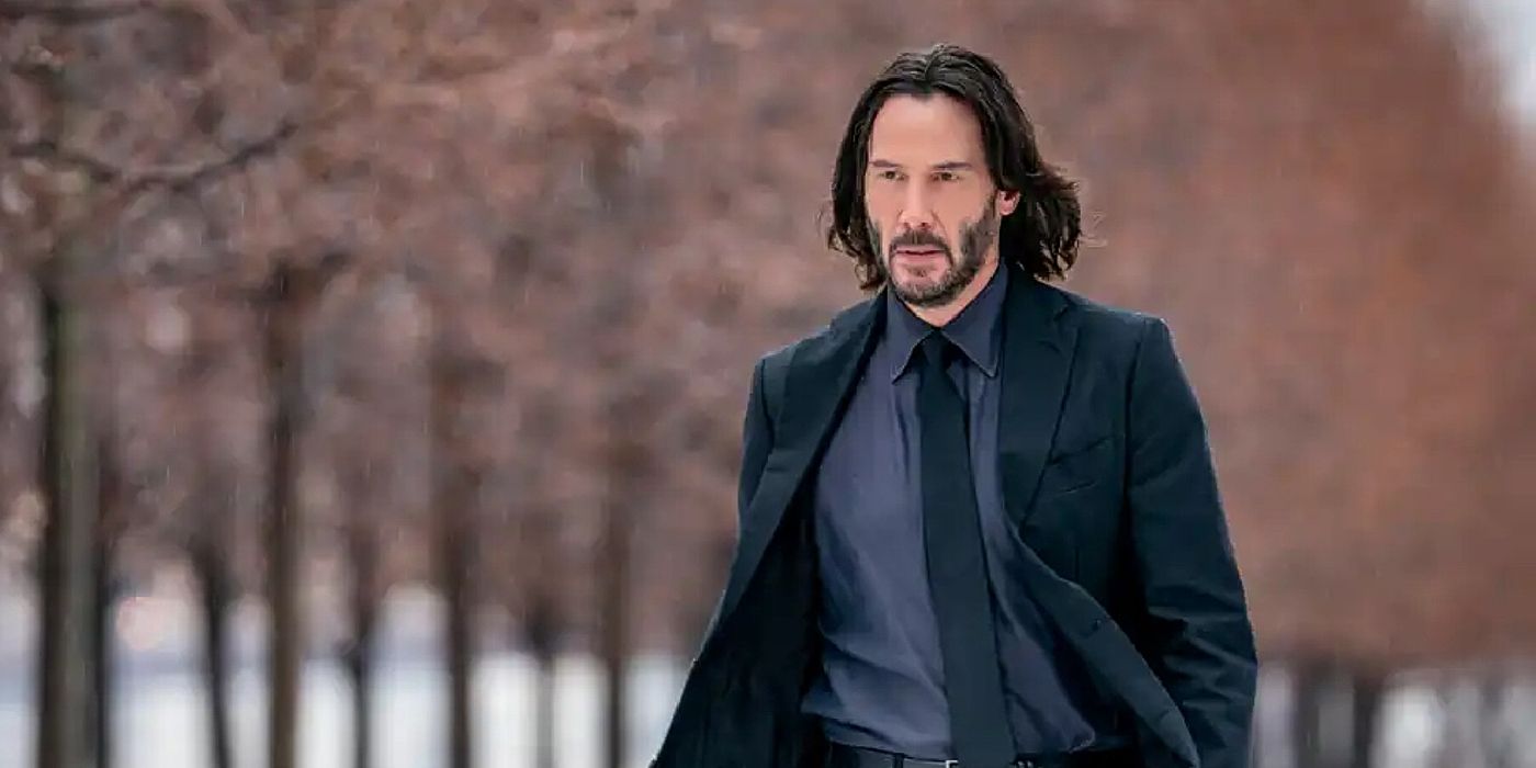 Keanu Reeves walking through a wintry NYC in John Wick: Chapter 4.