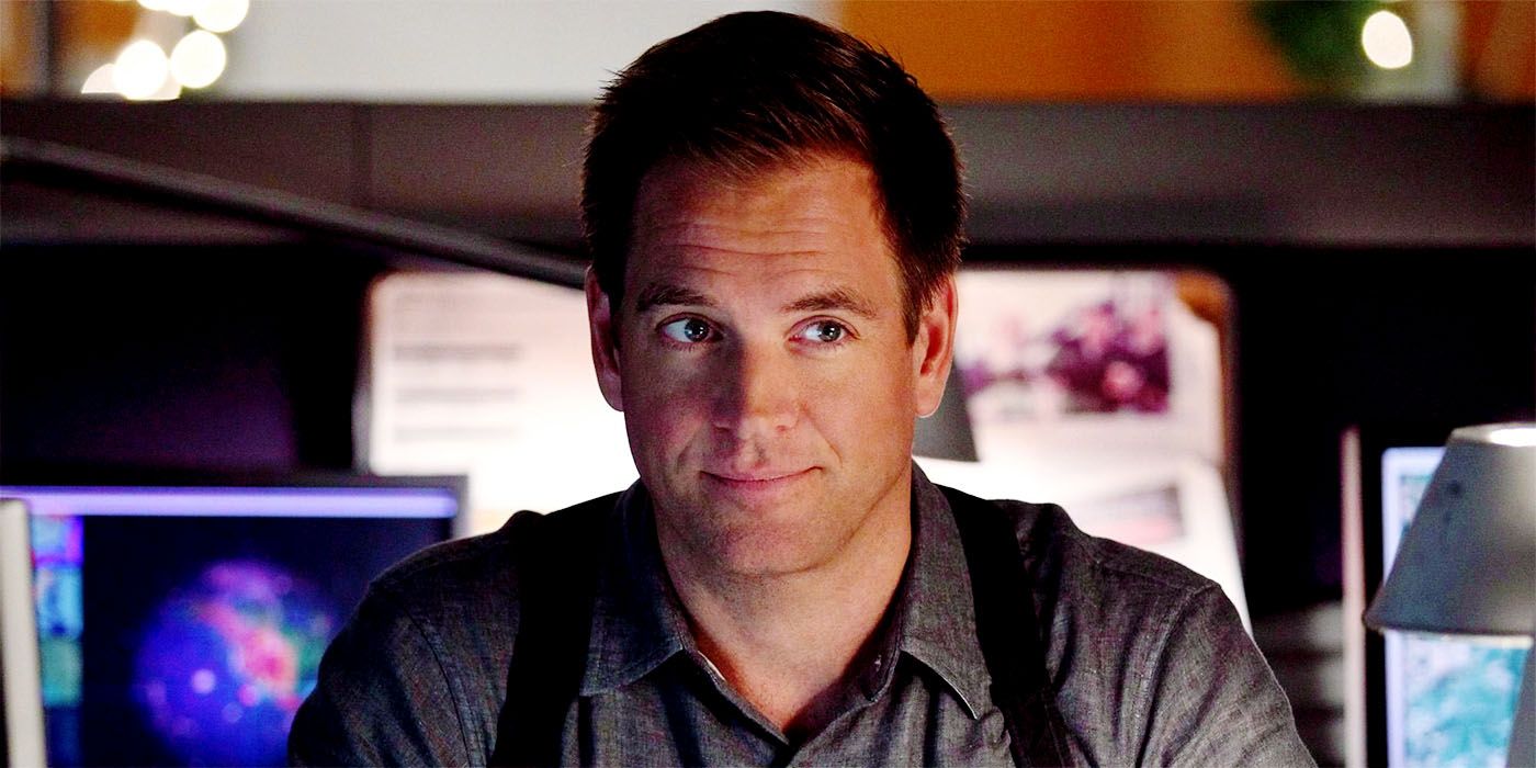 Michael Weatherly as Tony DiNozzo smiling at a desk on NCIS