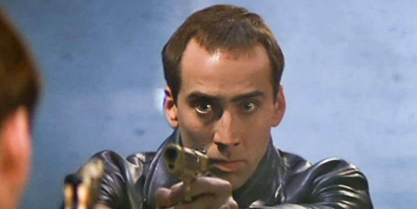 Nicolas Cage na cara/desligado com uma arma