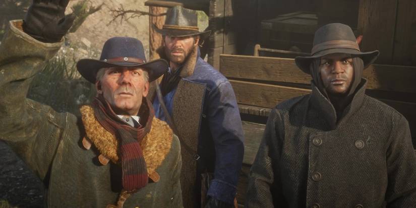 Screenshot of Red Dead Redemption 2 showing Hosea, Arthur and Charles in their winter clothes during the gang's journey to New Hannover.