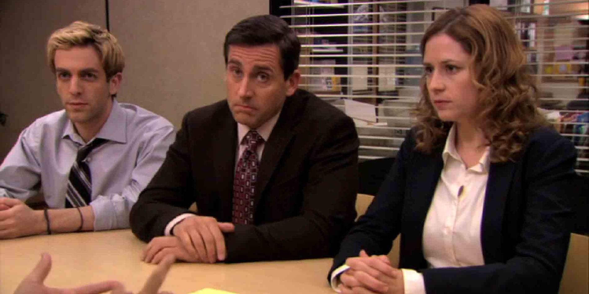 Ryan Michael and Pam sitting at table together negotiating with David Wallace