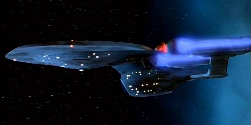 The Enterprise-C flies out of a time vortex from Star Trek The Next Generation