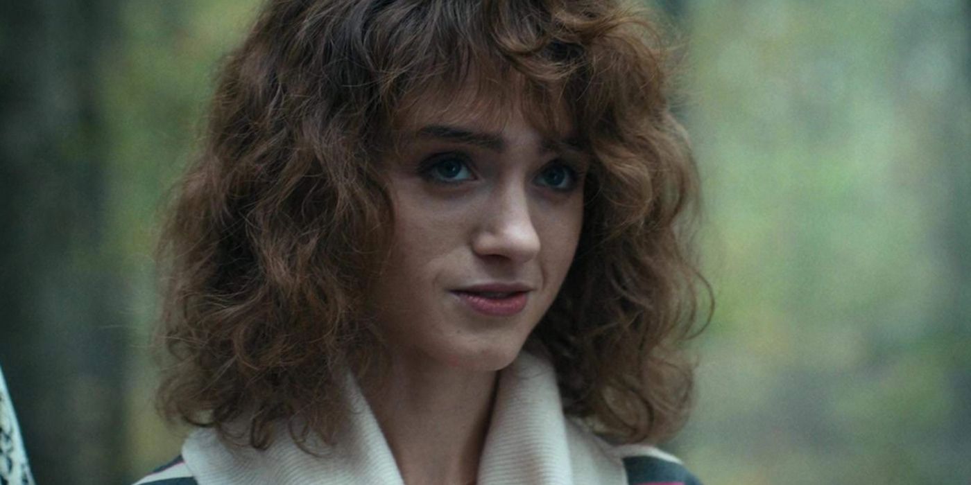 Nancy Wheeler (Natalia Dyer) smiling on Stranger Things