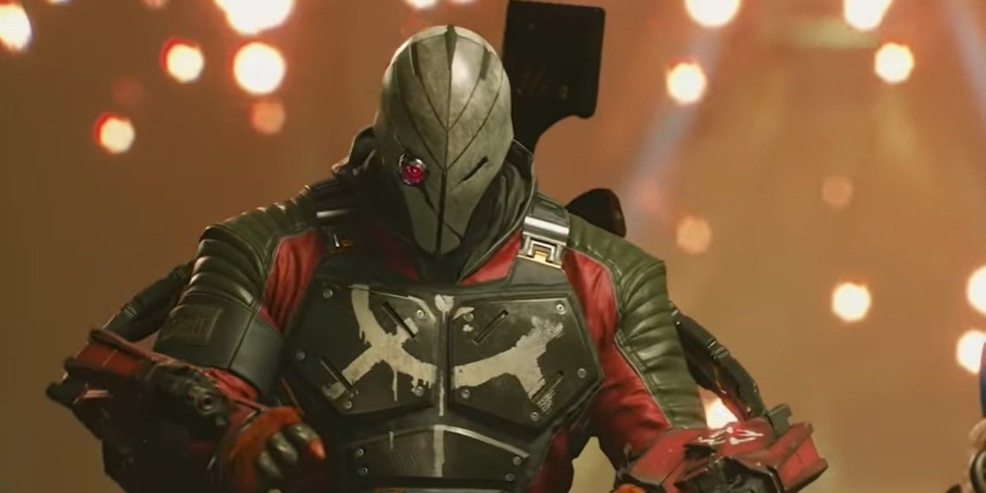 Deadshot in his mask and armor from Suicide Squad: Kill The Justice League, with embers from an explosion in the background.