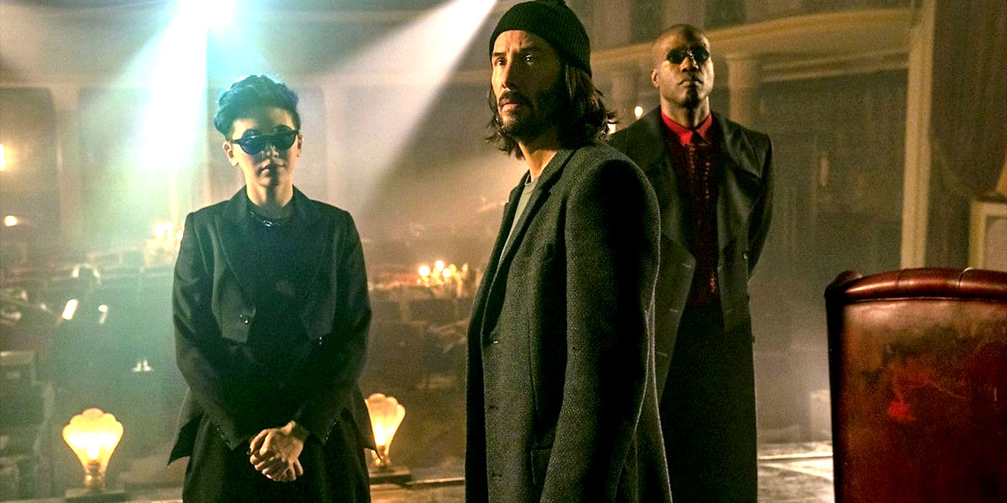 Neo (Keanu Reeves) Bugs (Jessica Henwick) and Morpheus (Yahya Abdul-Mateen II) in The Matrix Resurrections