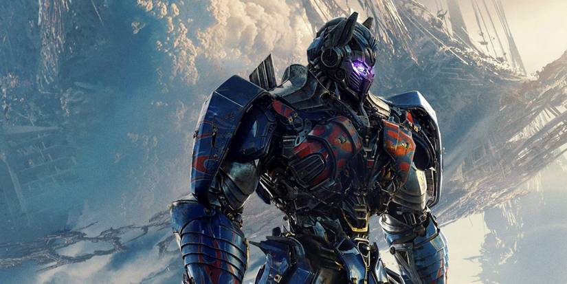 Optimus Prime facing to the right as his eyes glow in Transformers: The Last Knight