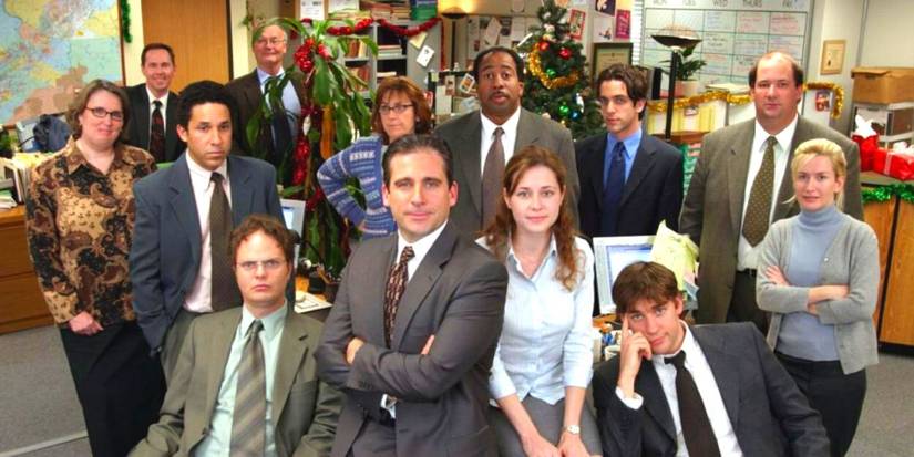 The Office cast posing at Christmas in the Dunder Mifflin office
