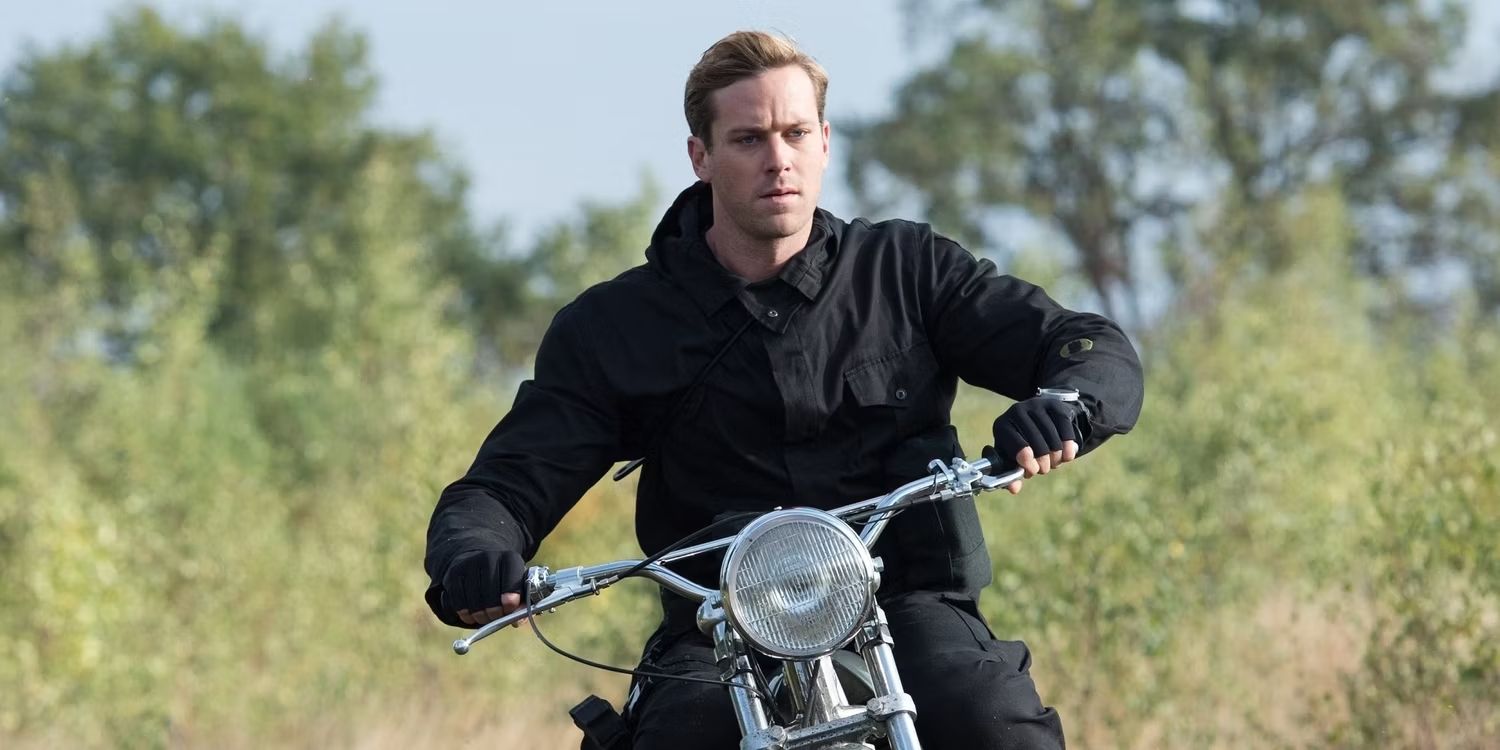 Armie Hammer riding a motorcycle in The Man From U.N.C.L.E.