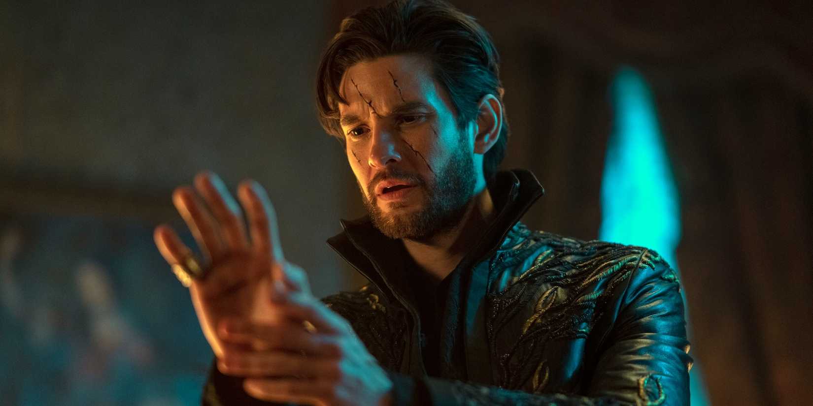 Ben Barnes as The Darkling Staring at HIs Hand in Shadow and Bone Season 2