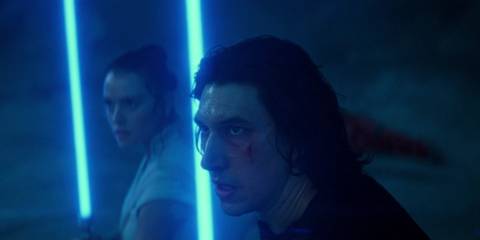 Ben Solo (Adam Driver) and Rey (Daisy Ridley) holding lightsabers in The Rise of Skywalker.