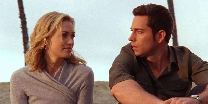 Yvonne Strahovski and Zachary Levi looking at each other in Chuck.