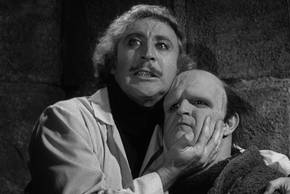 Dr Frankenstein (Gene Wilder) cradles the monster (Peter Boyle) in Young Frankenstein