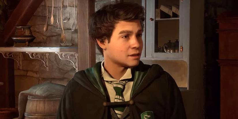 A close-up of Sebastian Sallow, a Slytherin student in Hogwarts Legacy, wearing his school robes and looking to his left.