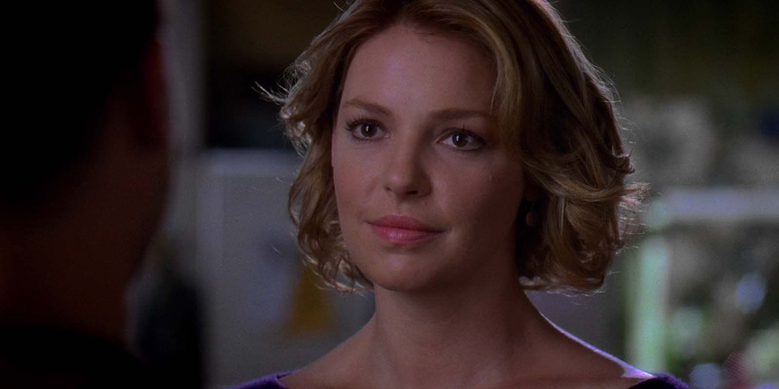 Katherine Heigl as Izzie Stevens smiling and looking at someone in Grey's Anatomy 