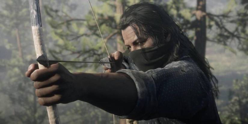 Charles Smith with a mask and bow in Red Dead Redemption 2