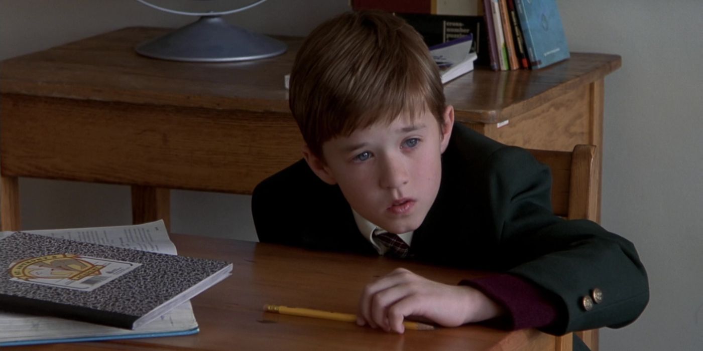 Haley Joel Osment at a desk in The Sixth Sense