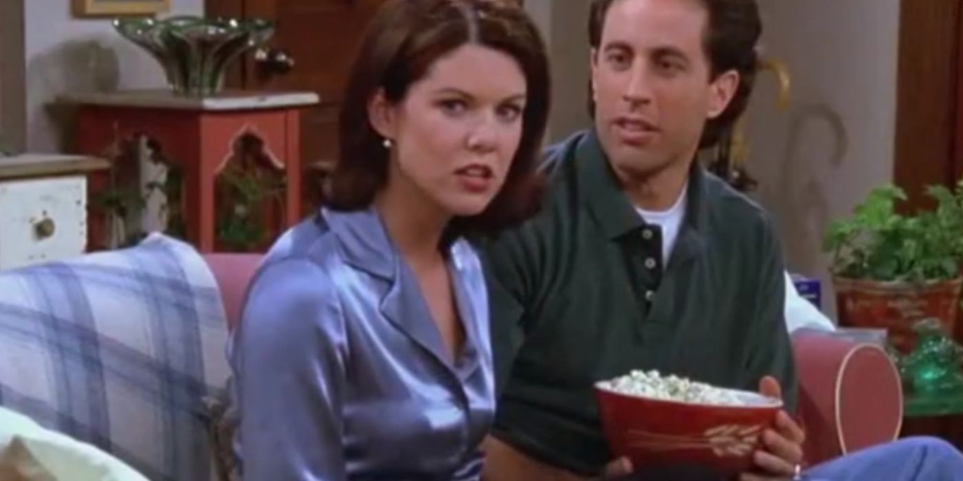 Valerie and Jerry sitting on the couch with popcorn on Seinfeld