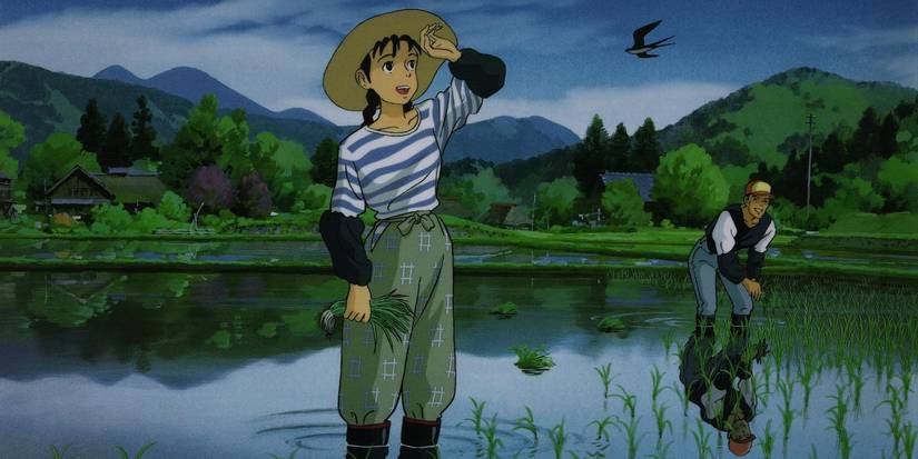 Taeko wipes her brow working the fields in Only Yesterday