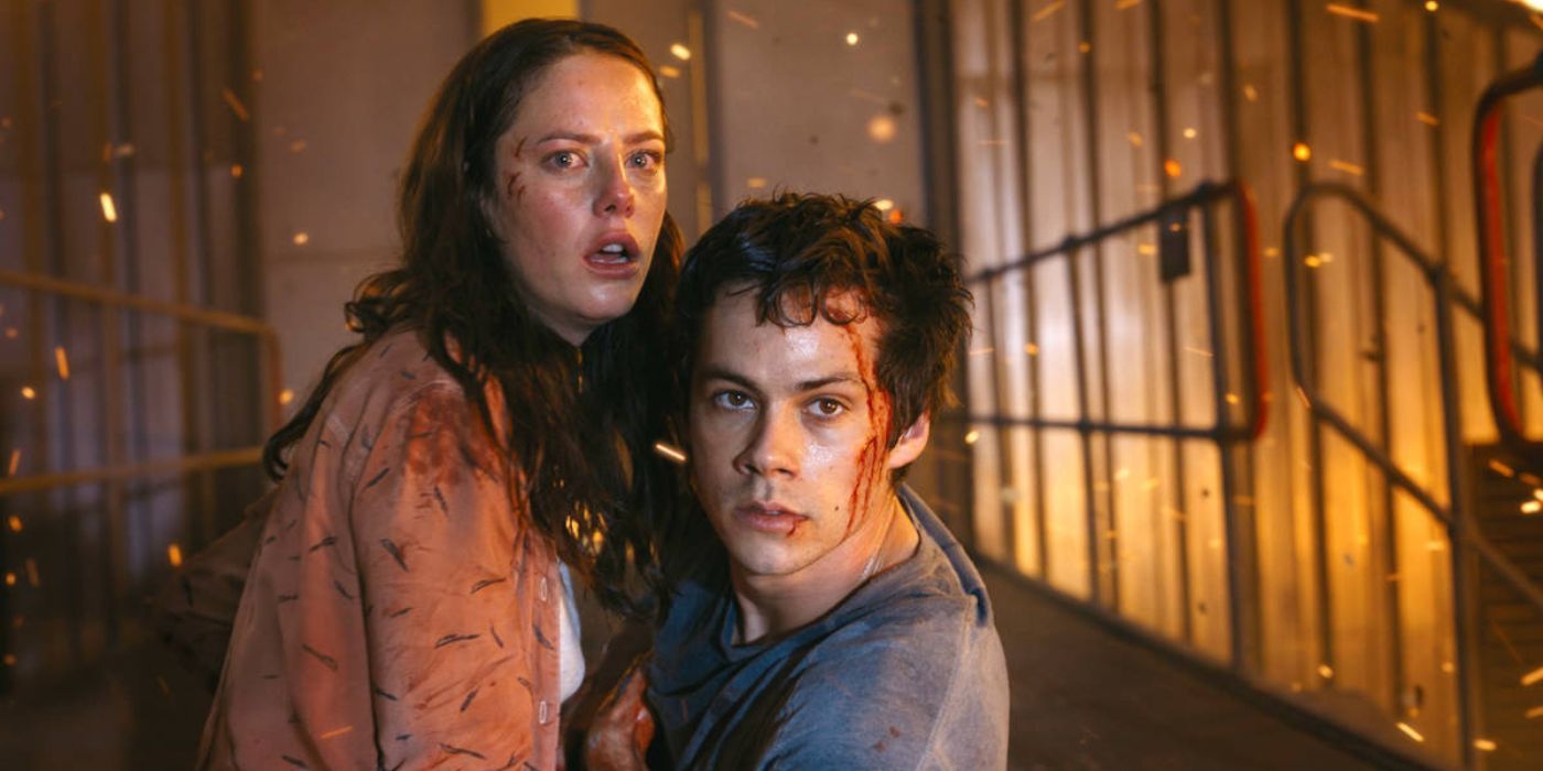 Kaya Scodelario and Dylan O'Brien as Teresa and Thomas looking on with fear in Maze Runner: The Death Cure 