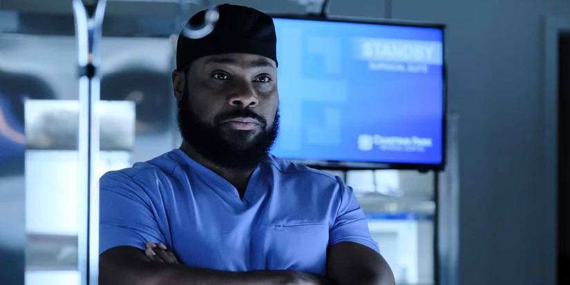 Malcolm Jamal-Warner as AJ looking serious with his arms crossed from The Resident