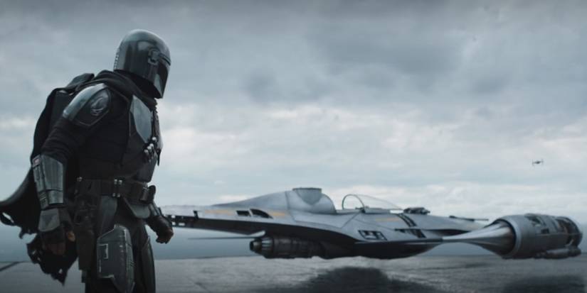 Din Djarin looking at his N-1 Starfighter in The Mandalorian season 3, episode 3