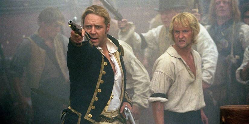 Jack (Russell Crowe) and Barrett (Billy Boyd) fighting on a ship deck in Master and Commander.