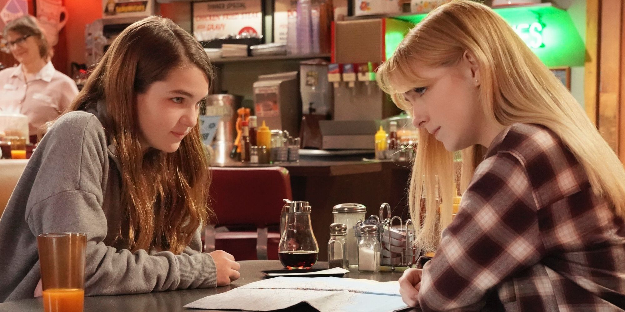 Missy and Paige sitting in a diner in Young Sheldon season 6