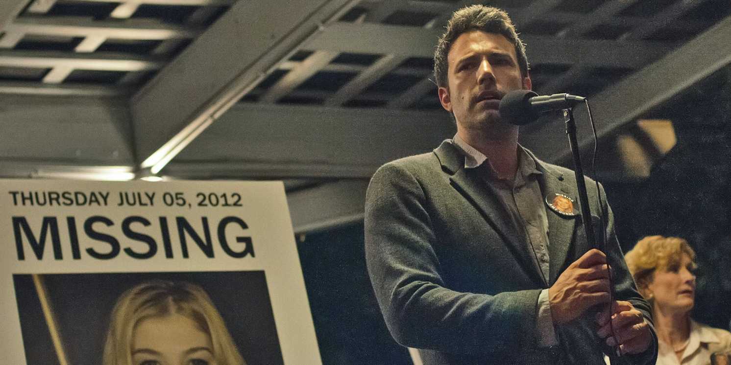 nick_in_front_of_amy-s_missing_poster_in_gone_girl David Fincher’s R-Rated Thriller That Grossed 6x Its Budget Is Coming To Paramount+ In 2 Weeks